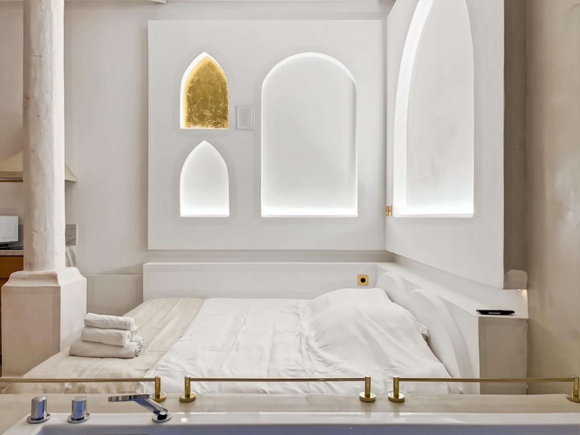 Headboard beneath the arched niches