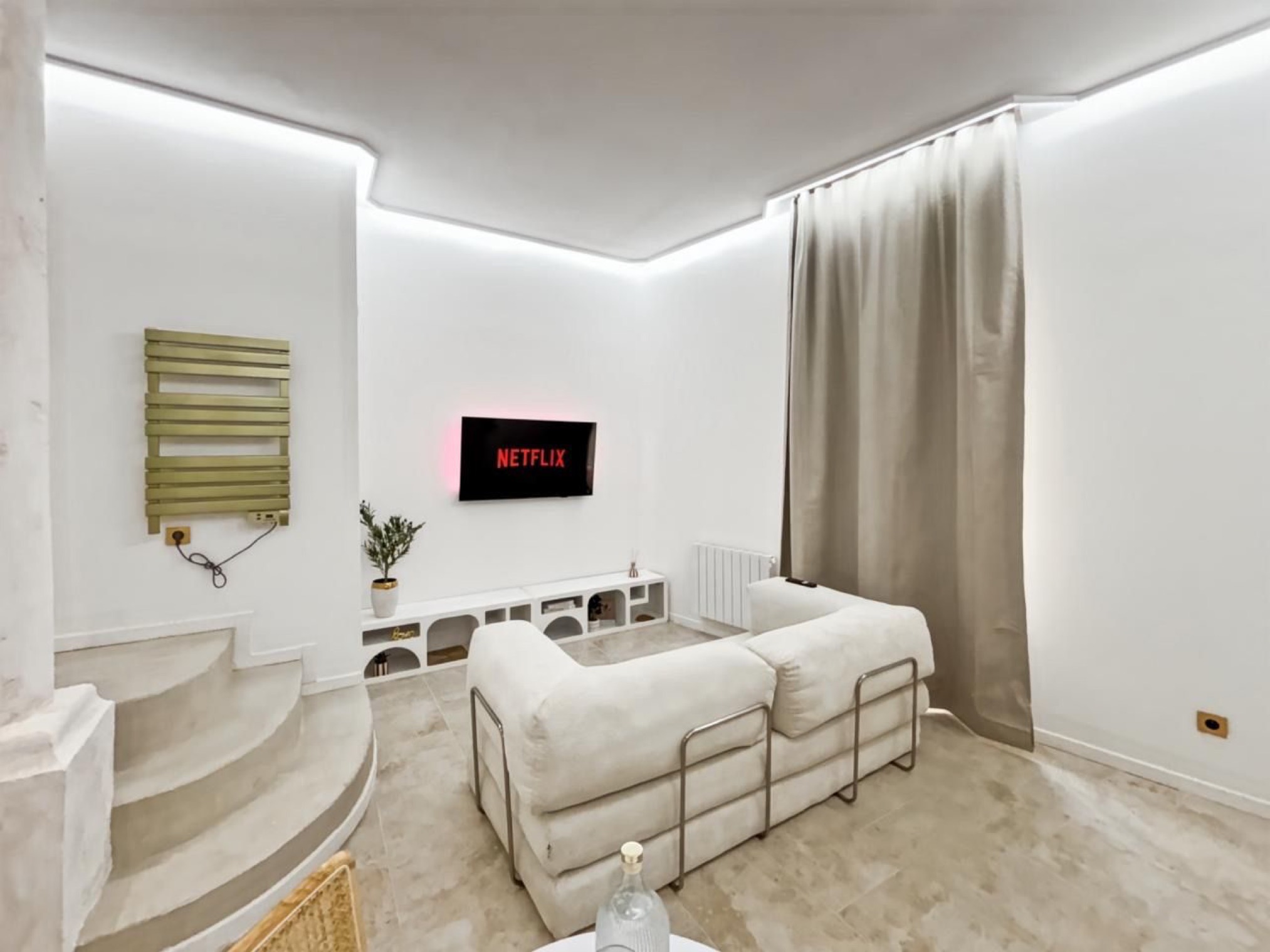 Sofa and television, view from the stairs