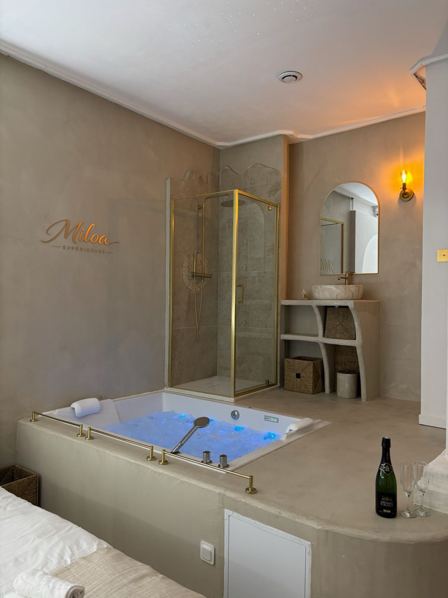 Jacuzzi, shower and basin in blue light