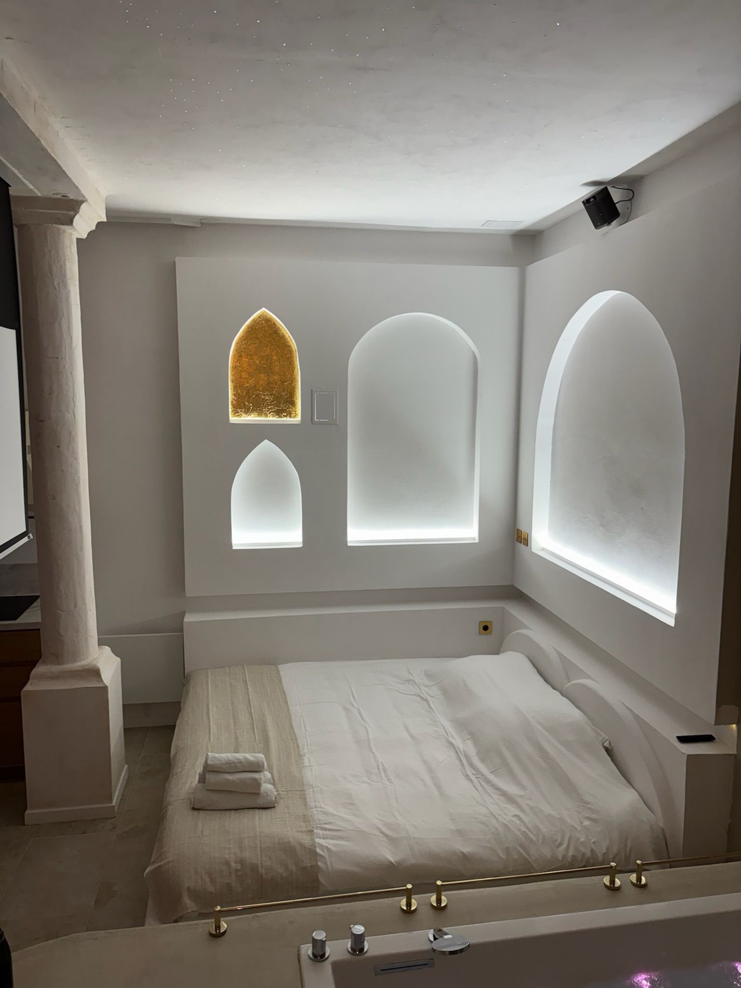 Bed beneath the arches, in the evening