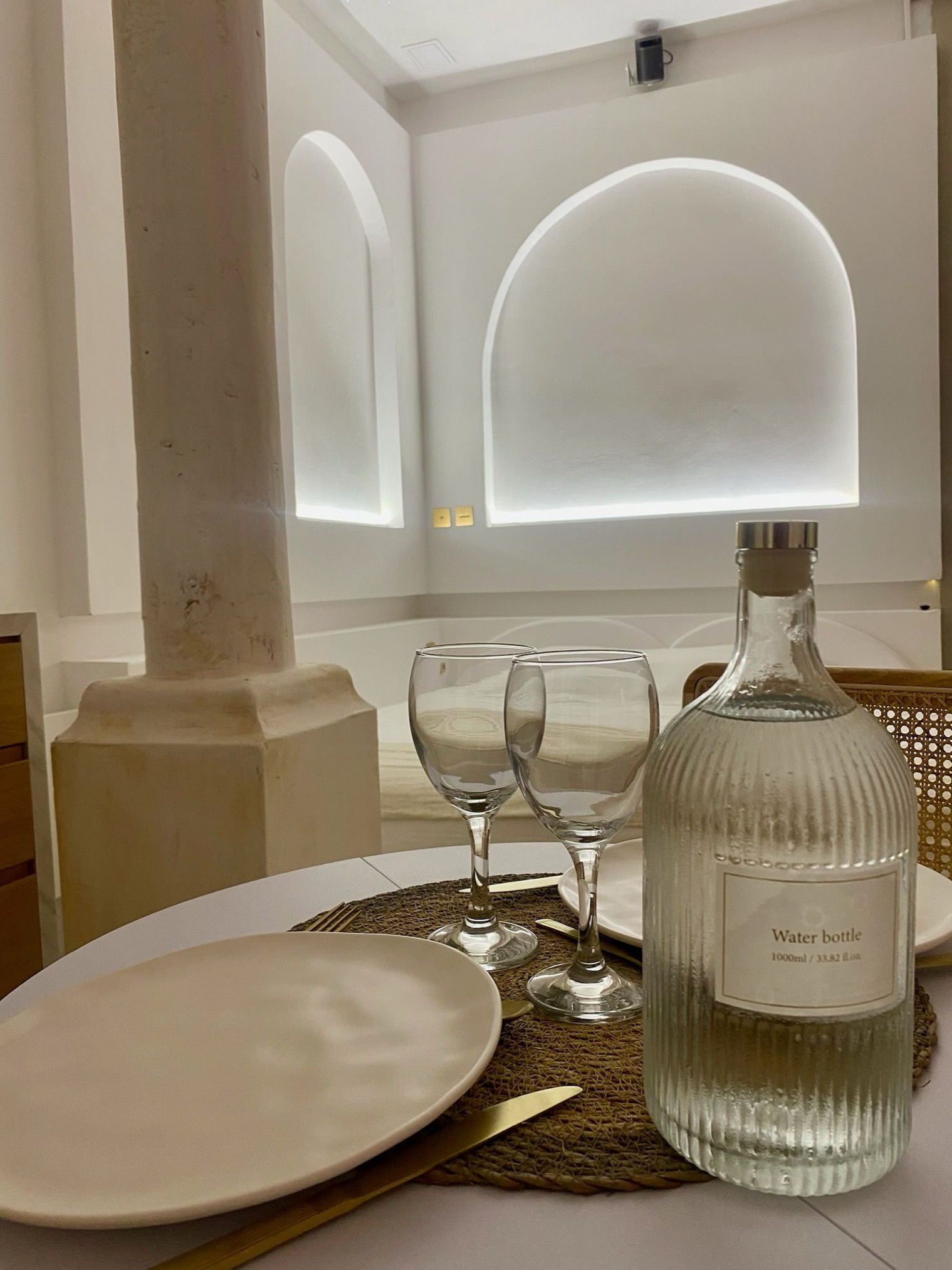 Table set with glasses and water carafe