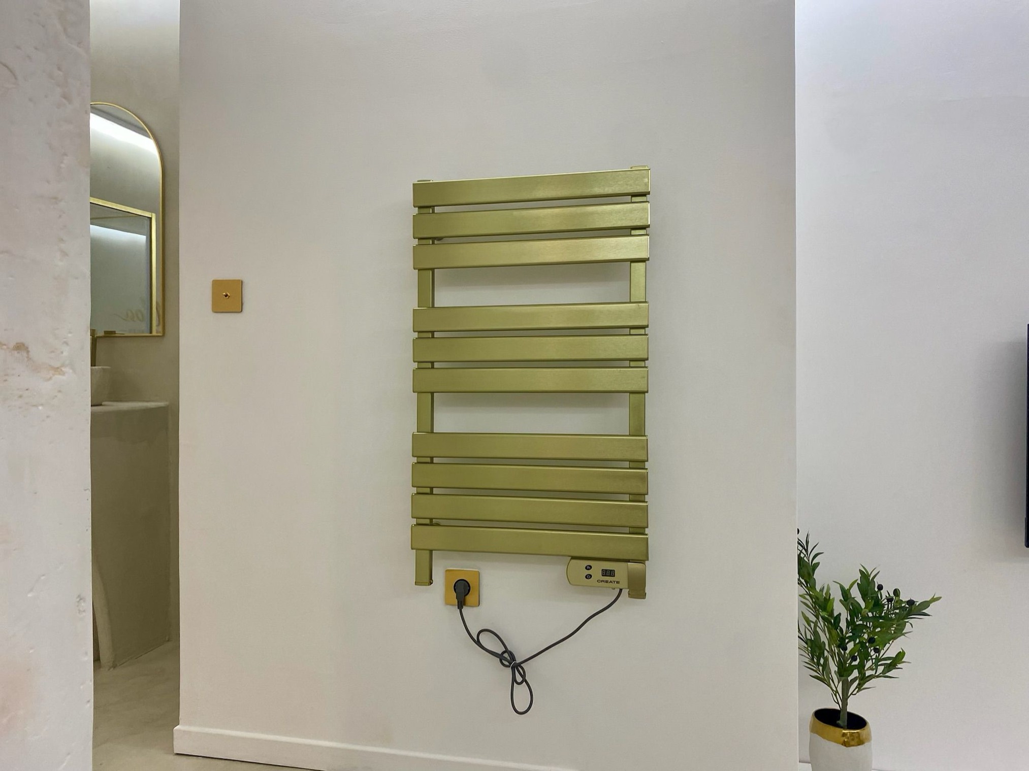 Gold heated towel rail