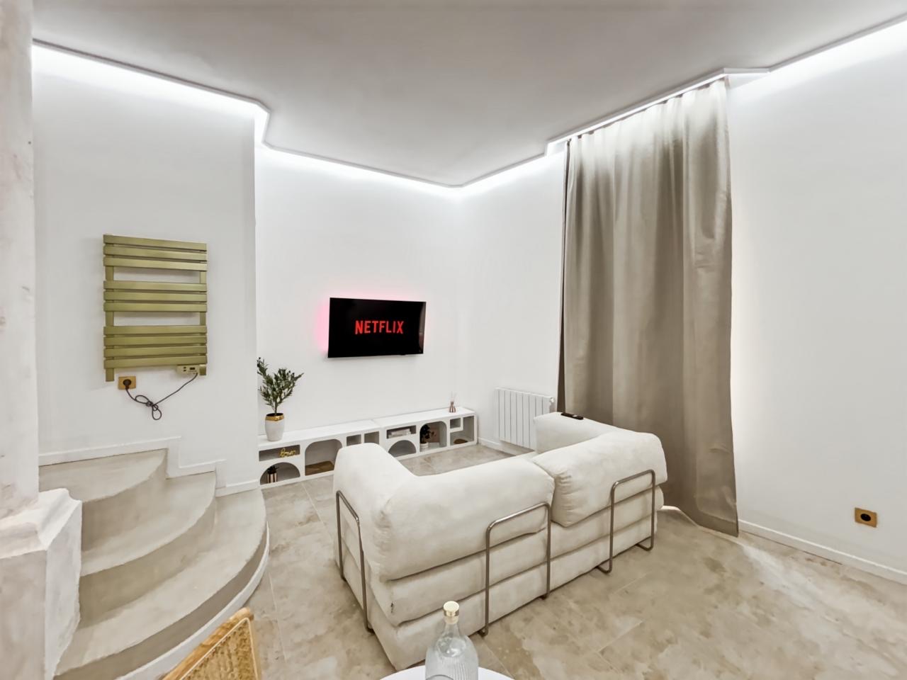 Cosy lounge corner with screen for a film night for two