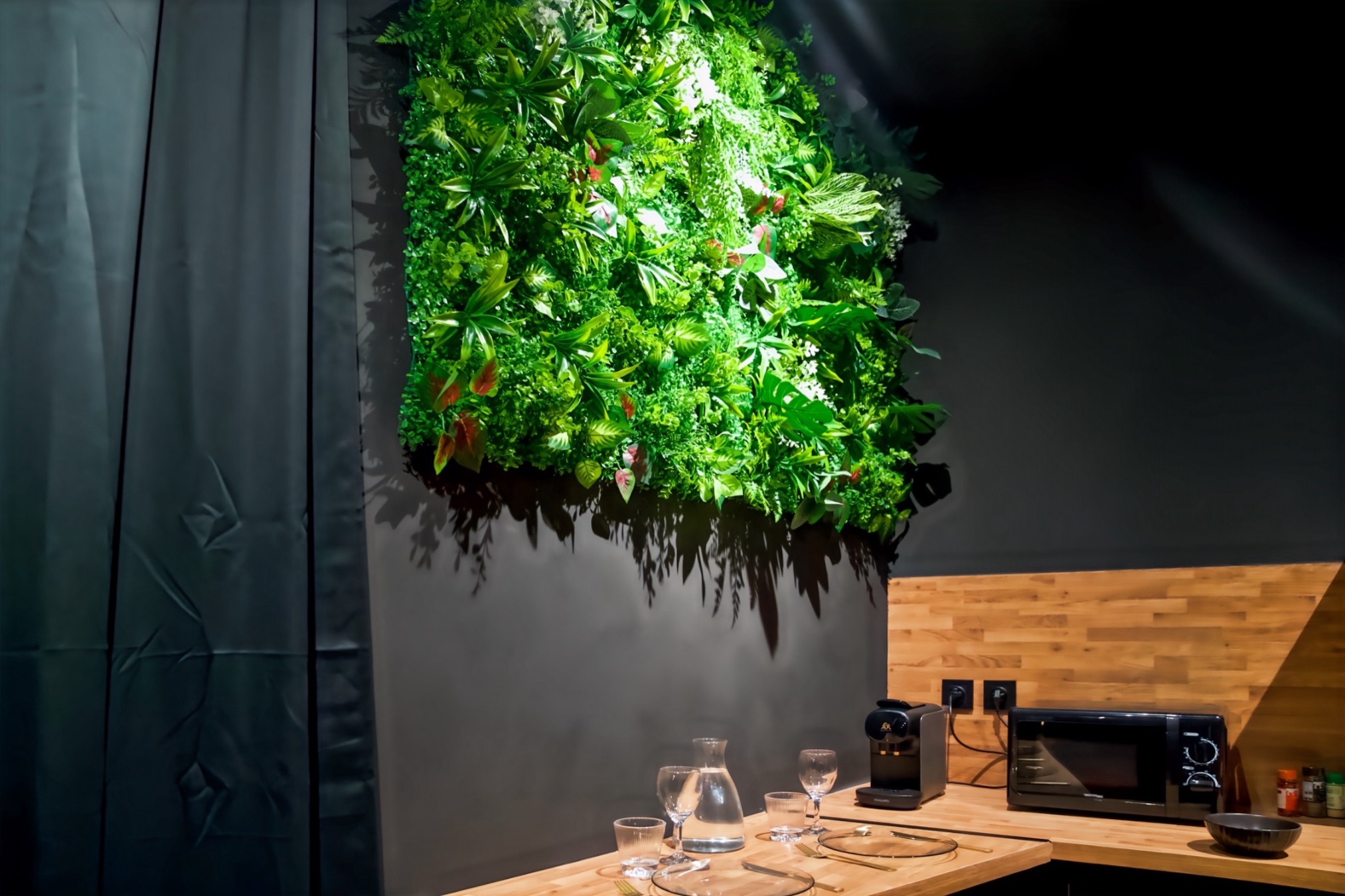 Table set beneath the living wall