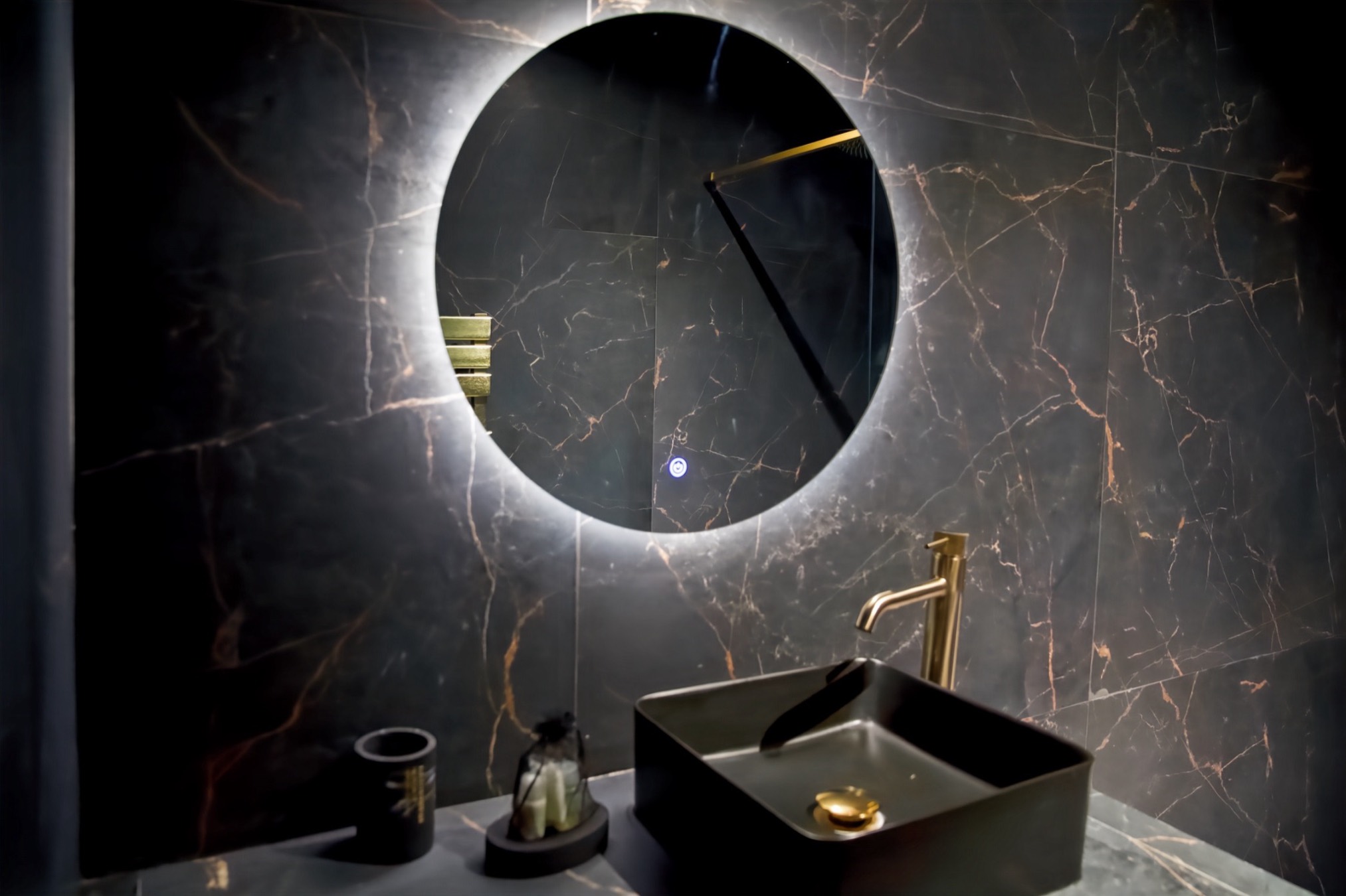 Black basin and round backlit mirror