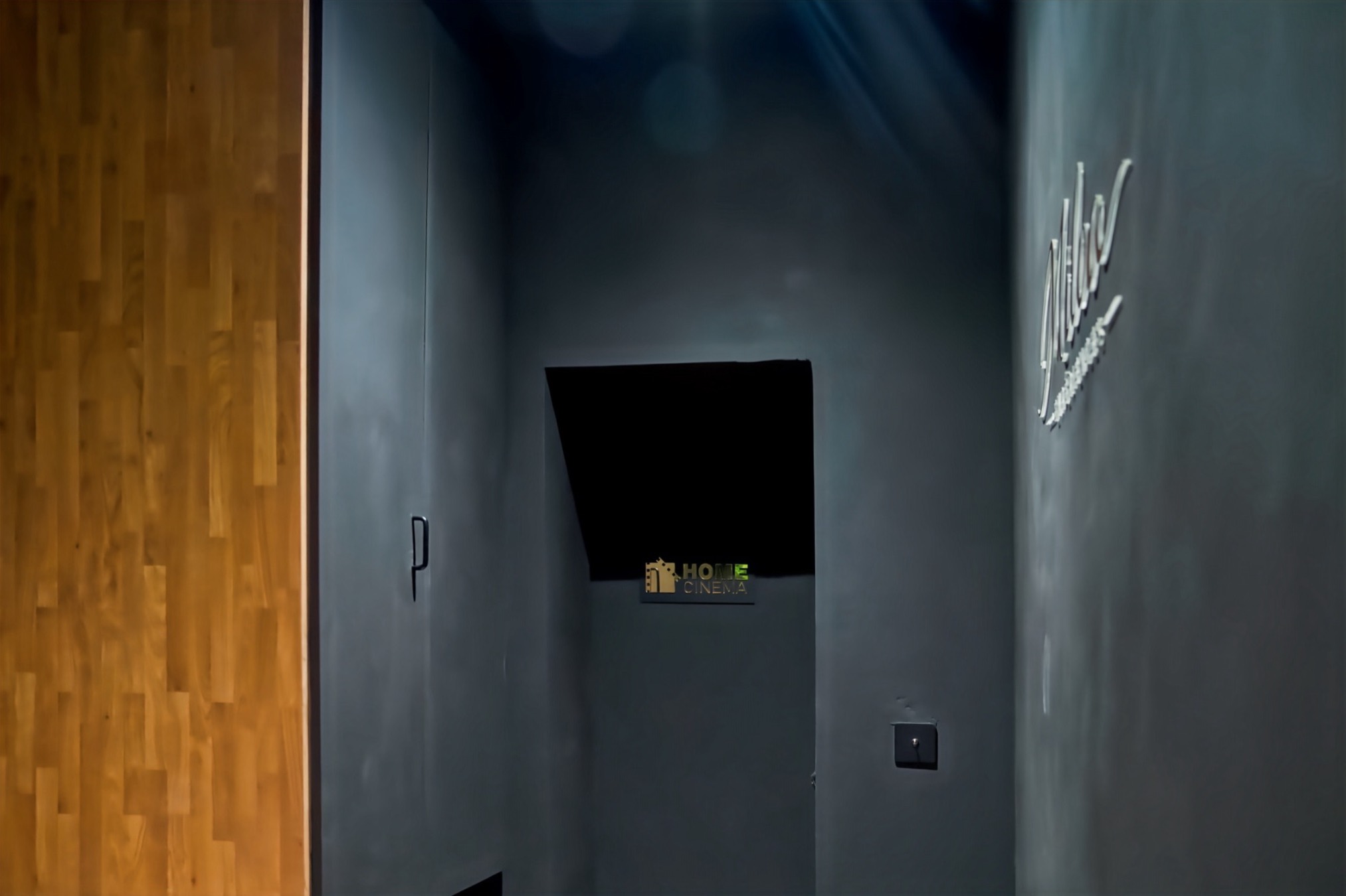 Entrance hallway with the Home Cinema and Miloa signs